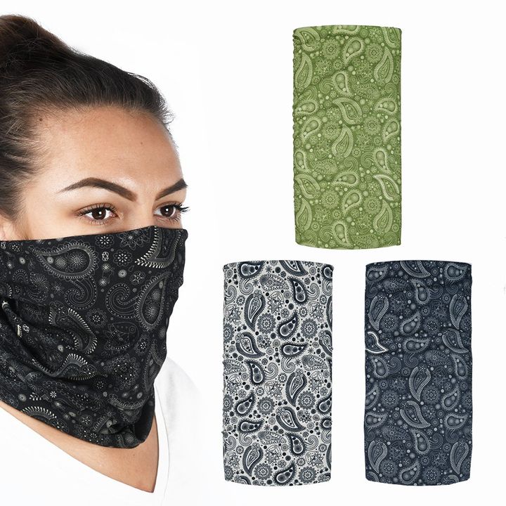 A woman wears a black bandana with a paisley pattern covering her face, with three additional bandanas in green, black and white, and blue displayed to the right, all with similar paisley designs.