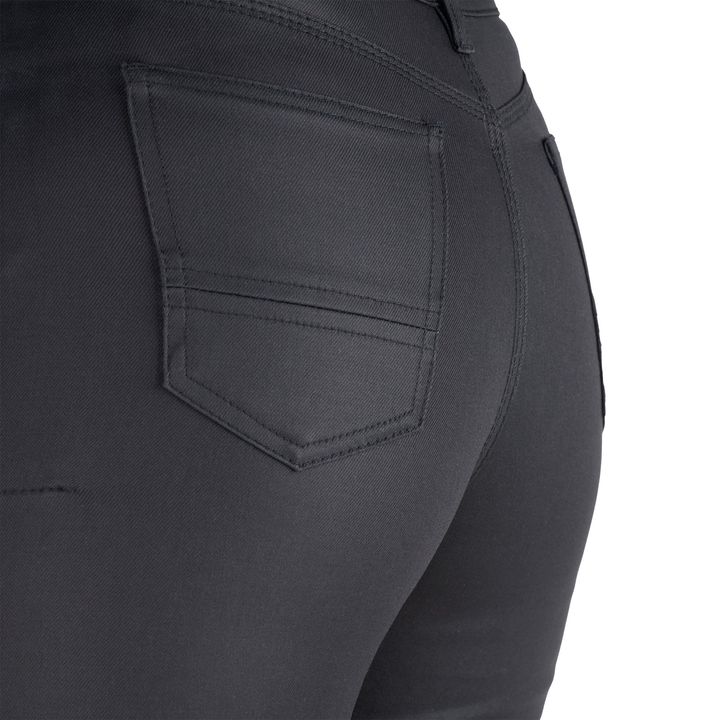 Close-up of a black pair of trousers, focusing on the pocket design on the side.