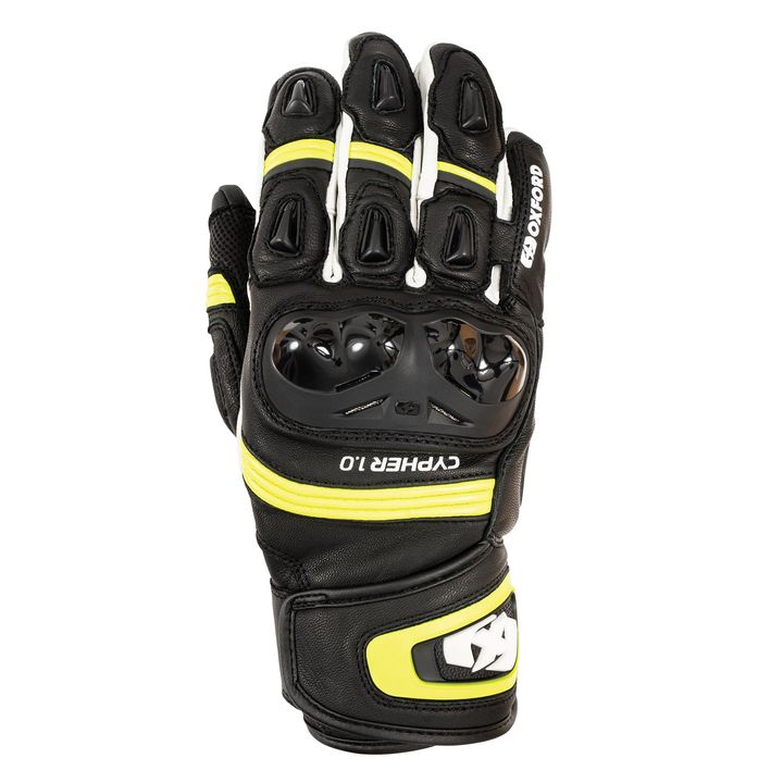 A black motorcycle glove with yellow accents and protective carbon fiber knuckle guards, displayed against a white background.