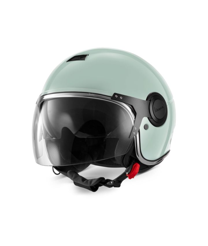 Vespa Argentario Helmet A mint green motorcycle helmet with a black visor and chin strap, displayed on a white background.