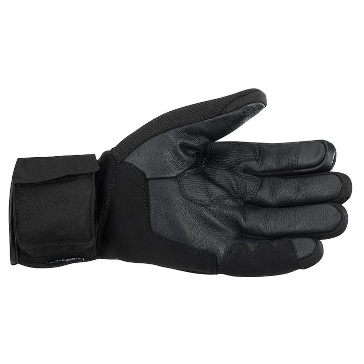 A single black tactical glove displayed with the palm side facing up against a white background.