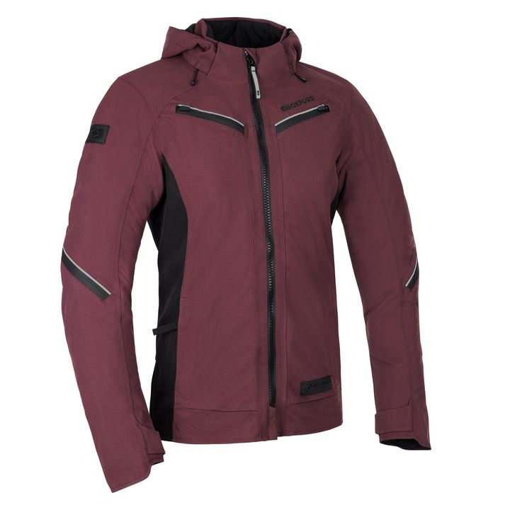 Mondial Street D2D Womens Jacket A maroon technical outdoor jacket with black side panels, multiple zippered pockets, a high-collar, and visible logo patches on the chest and arm.