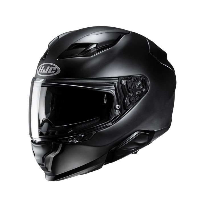 A black full-face motorcycle helmet with a clear visor, featuring venting and the HJC logo on the front.