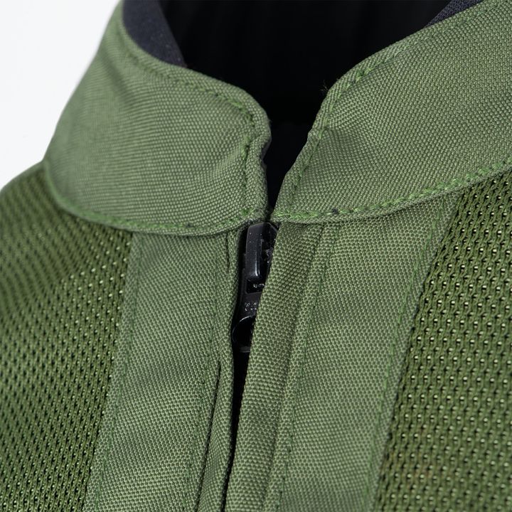 Close-up of a green jacket with a partially zipped black zipper and textured fabric.