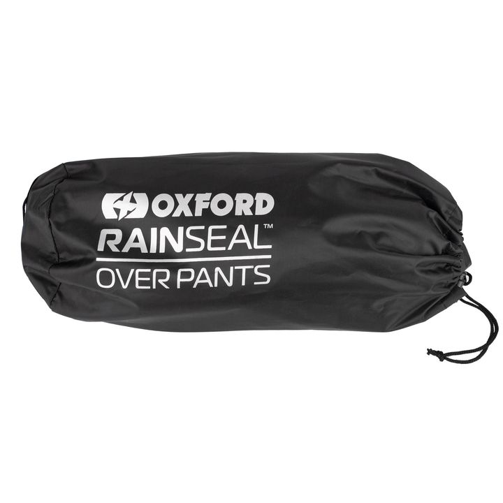 A black Oxford Rainseal over pants packaging bag with white text on it, isolated on a white background.