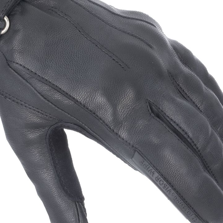 Close-up of a black leather glove showing detailed stitching and textured material.