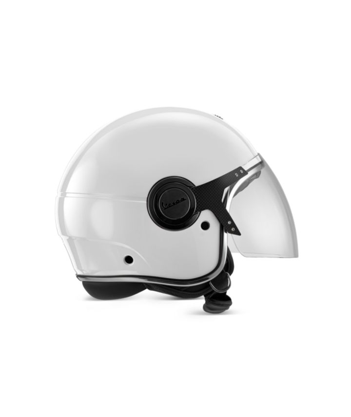 A white Vespa brand open-face motorcycle helmet with attached clear visor on a white background.