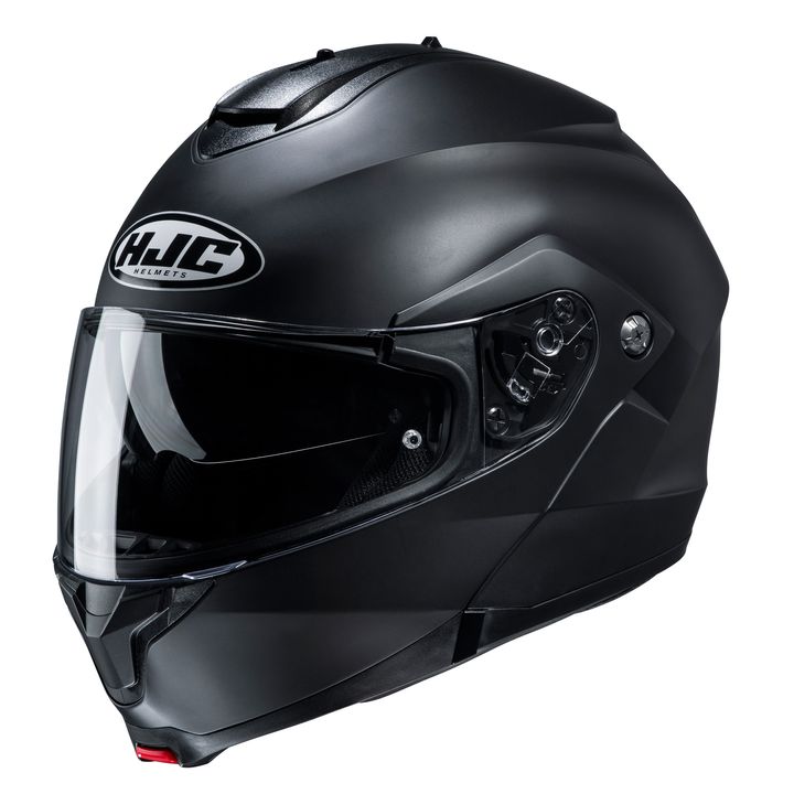 A black full-face motorcycle helmet with a clear visor and the HJC logo on the front, isolated on a white background.